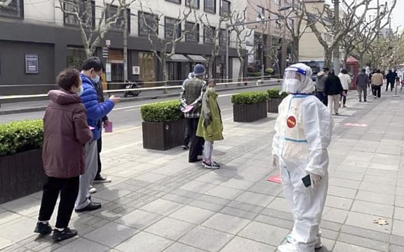 Residents line up to take PCR tests under the Covid-19 lockdowns in Shanghai, China on 1 April 2022.