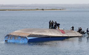 Tanzanian rescue workers search for victims, a day after the ferry MV Nyerere capsized in Lake Victoria.
