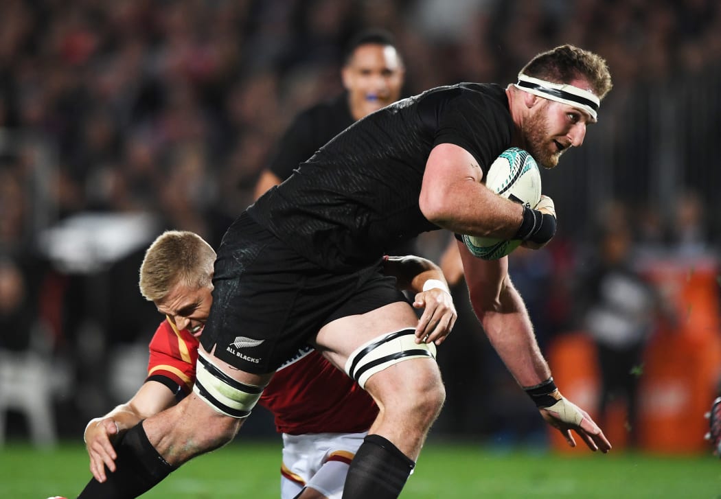 Kieran Read tackled by Gareth Anscombe.