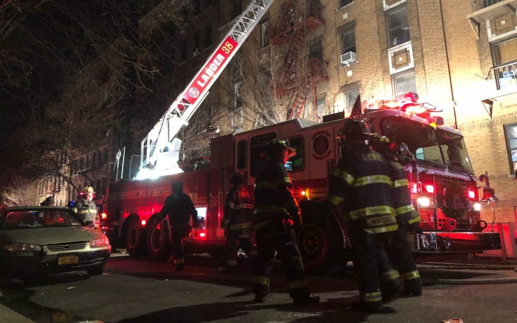 Firefighters at the blaze at an apartment building in the Bronx borough of New York City.