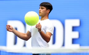 Carlos Alcaraz plays football with a giant tennis ball during Arthur Ashe Kid's Day ahead of the US Open earlier this month.