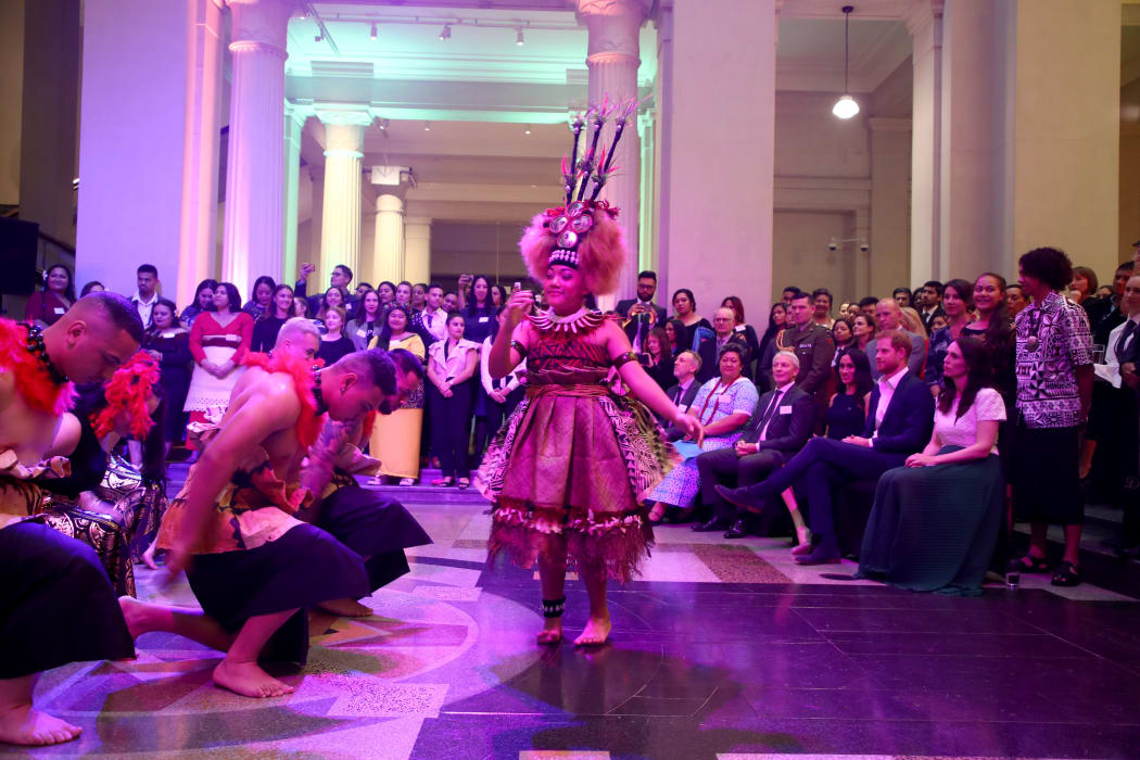 Duchess of Sussex Meghan and Prince Harry watch a cultural performance as they attend the Auckland War Memorial Museum.