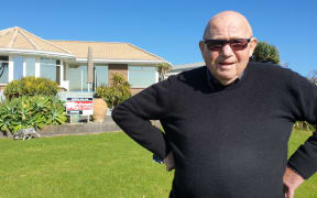 George Corlett outside his Onaero home.