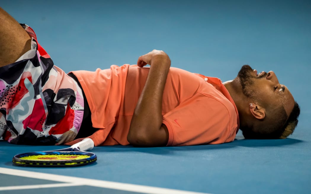MELBOURNE, VIC - JANUARY 27: Nick Kyrgios of Australia collapses after losing a point during the fourth round of the 2020 Australian Open on January 27 2020, at Melbourne Park in Melbourne, Australia. (Photo by Jason Heidrich/Icon Sportswire)