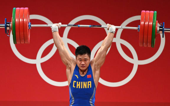 China's Lyu Xiaojun competes in the men's 81kg weightlifting competition during the Tokyo 2020 Olympic Games at the Tokyo International Forum in Tokyo on July 31, 2021.