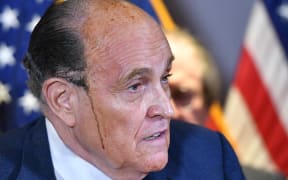 Trump's personal lawyer Rudy Giuliani perspires as he speaks during a press conference at the Republican National Committee headquarters in Washington, DC, on November 19, 2020.