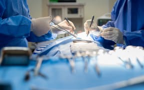 Generic shot of operating table/surgery in hospital.