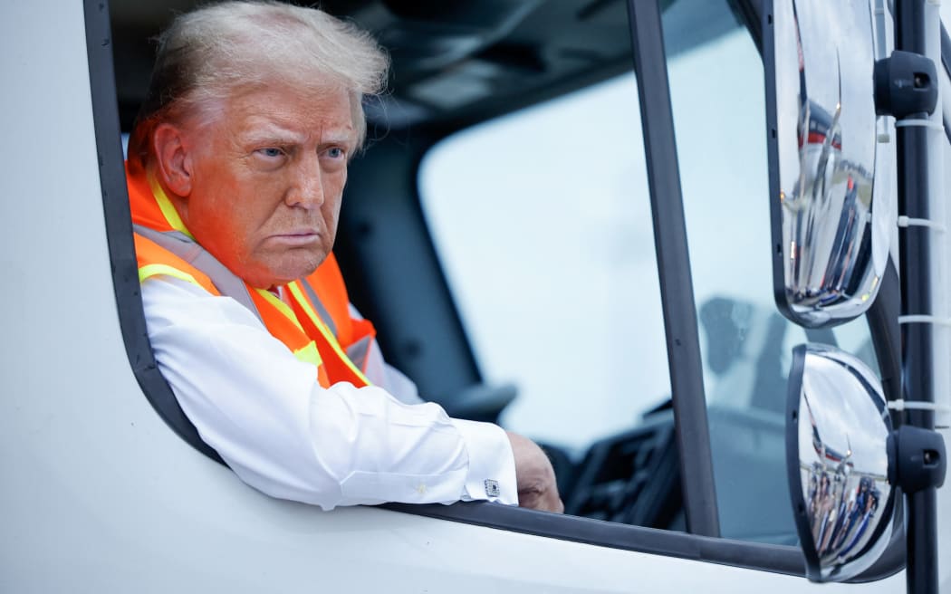 GREEN BAY, WISCONSIN - OCTOBER 30: Republican presidential nominee, former President Donald Trump holds a press conference from inside trash hauler at Green Bay Austin Straubel International Airport on October 30, 2024 in Green Bay, Wisconsin. With less than a week until Election Day, Trump is campaigning for re-election in the battleground states of North Carolina and Wisconsin.   Chip Somodevilla/Getty Images/AFP (Photo by CHIP SOMODEVILLA / GETTY IMAGES NORTH AMERICA / Getty Images via AFP)