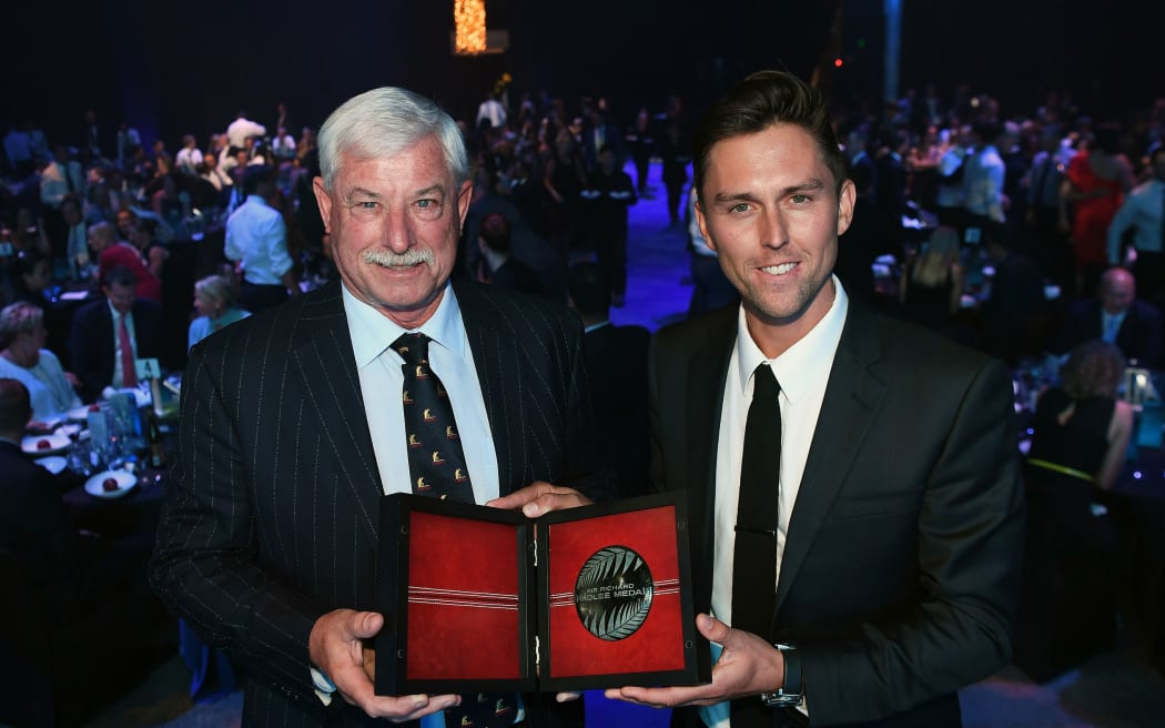 Trent Boult receives award from Sir Richard Hadlee.