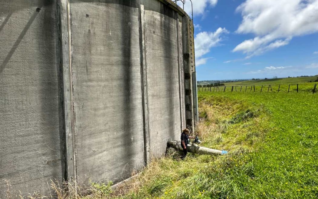NPDC Water Treatment Plant lead Rachelle Quin checks outlet valve at Tikorangi Reservoir.