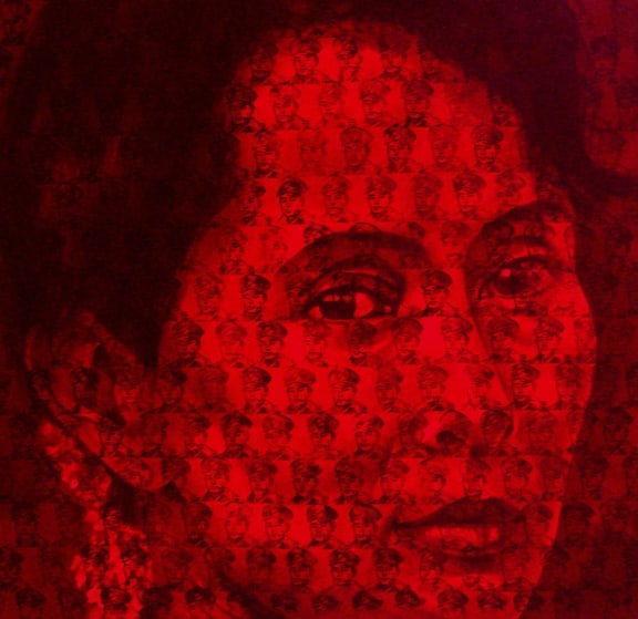 The portrait of NLD leader Aung Sang Suu Kyi has tiny portraits of her father stamped all over the image.