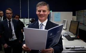 Bill English picking up the Budget at the printery in Petone, Lower Hutt.