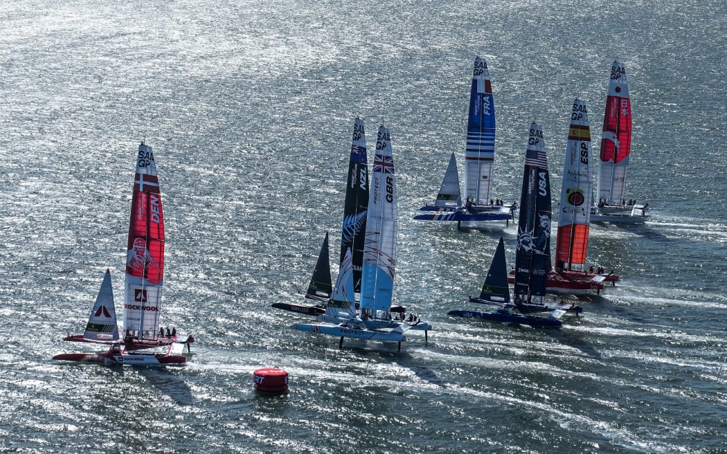 Boats on the start line of a SailGP race in San Francisco.