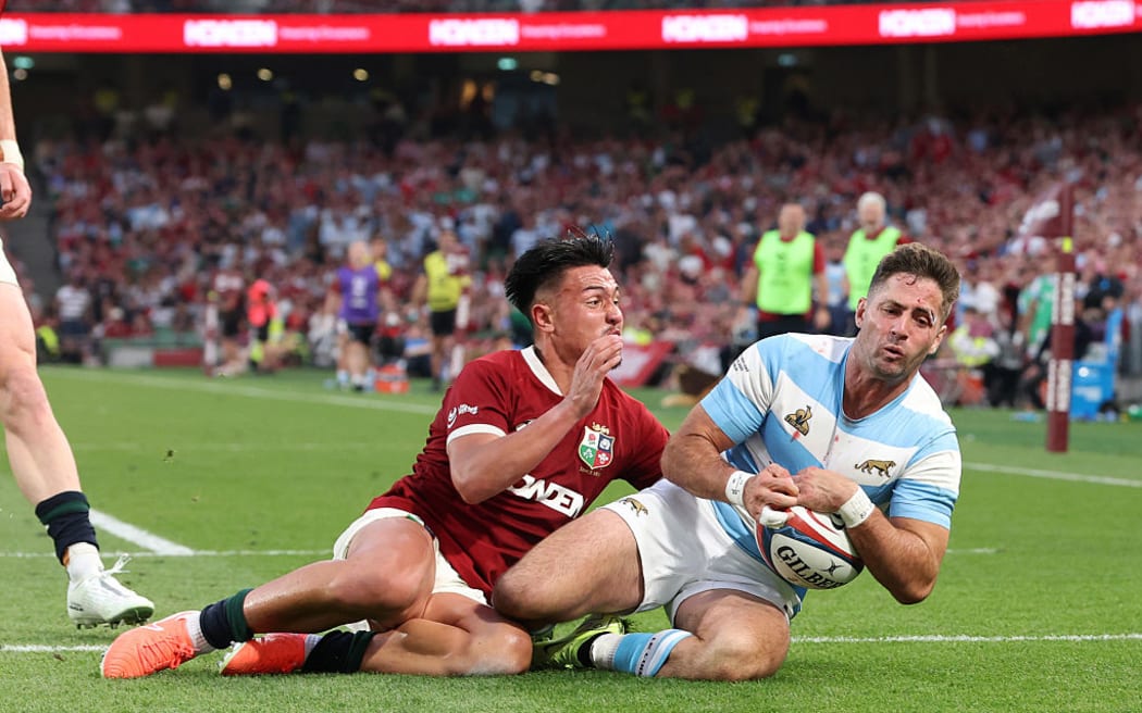 Santiago Cordero of Argentina scores the match winning try against the British & Irish Lions in Dublin.