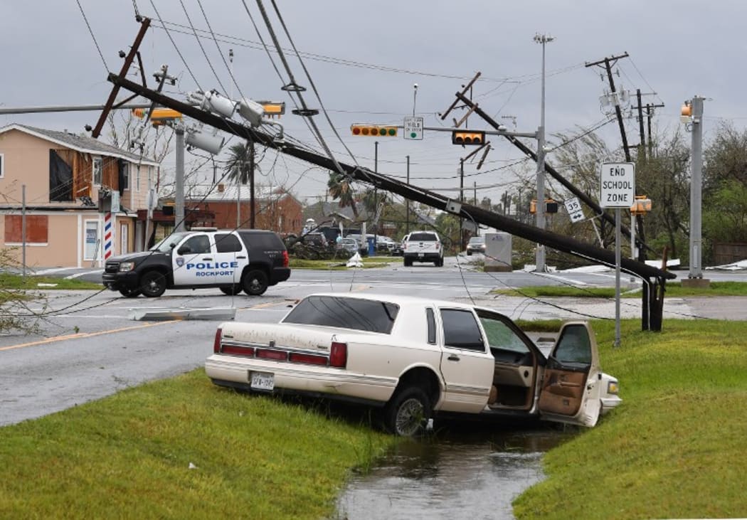 A car lies abandoned after heavy damage in Rockport, Texas.