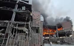 This video grab taken from undated UGC images posted on social media on March 23, 2026, shows destruction and fire at the Iranian ministry of defence’s electronics industries building in Tehran following a strike. Iranian media said on March 23 there were no negotiations between Tehran and Washington after the US president announced talks towards ending the war. (Photo by various sources / AFP) /