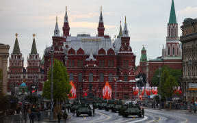 T-34 Soviet-era tanks are seen in a street near near the State Historical Museum and the Kremlin wall on the day of a rehearsal for a military parade, which marks the 80th anniversary of the victory over Nazi Germany in World War II in central Moscow on April 29.