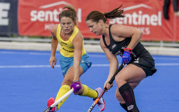 Black Sticks Ella Gunson and Australia's  Rosie Malone do battle.