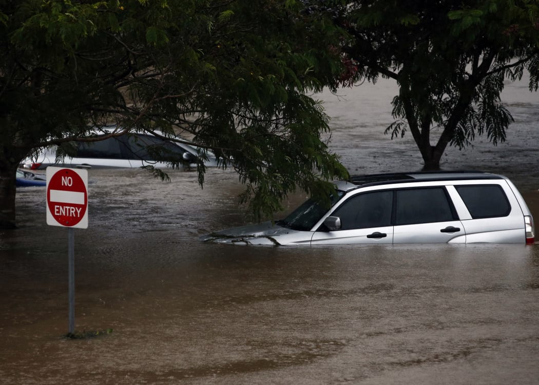 Flood waters enter in the parking lot outside the Robina Hospital on the Gold Coast as severe rain continue throughout south-east Queensland following Cyclone Debbie, on 20 March, 2017.