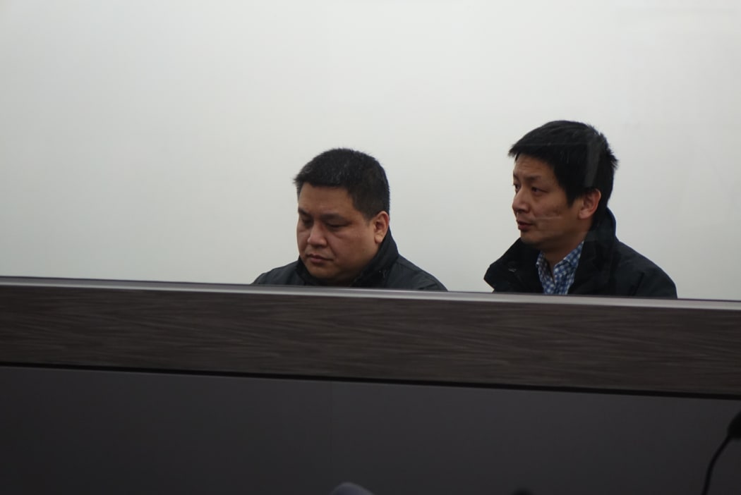 Limin Ma, left, with an interpreter at his sentencing for careless driving causing death in the Dunedin District Court on 7 September 2016.