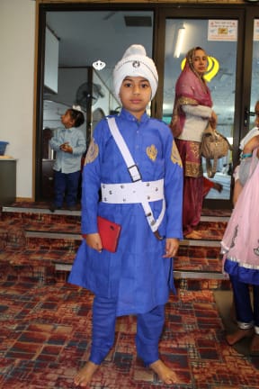 Sikh boy wears the five Ks