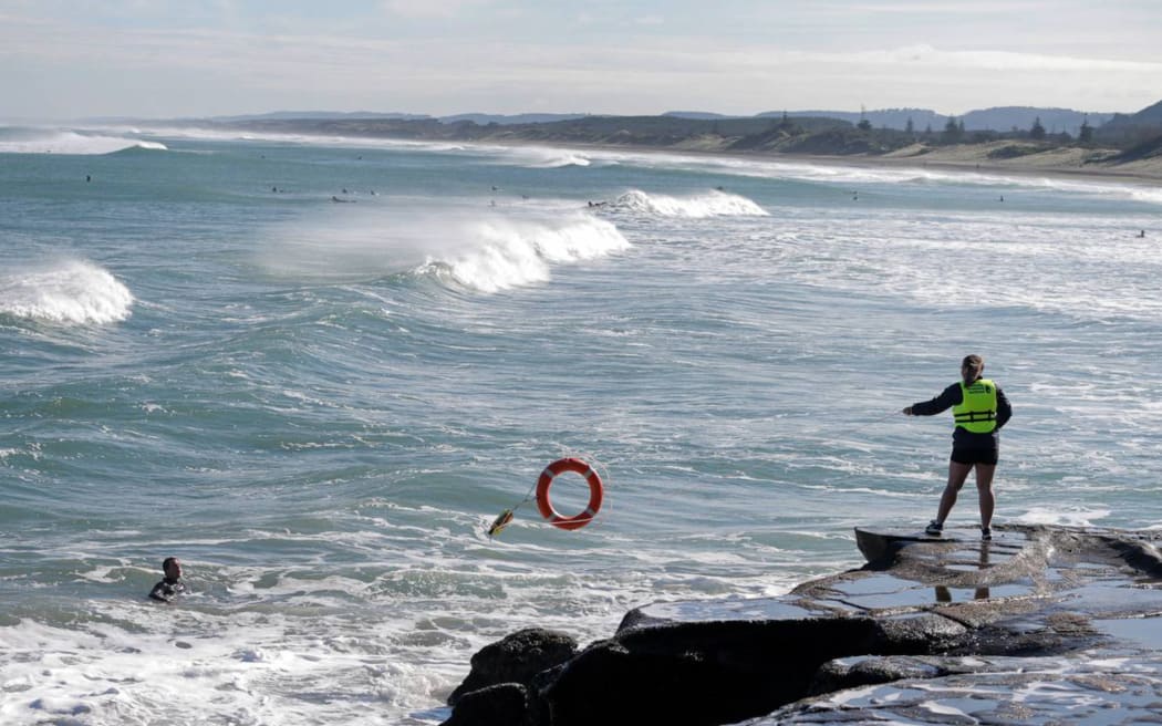 A demonstration on using public rescue equipment at Muriwai Beach.