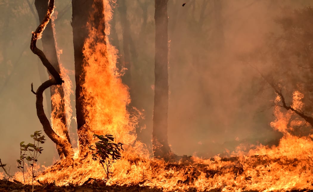 A bushfire burns on a property in Balmoral, 150 kilometres southwest of Sydney on December 19, 2019