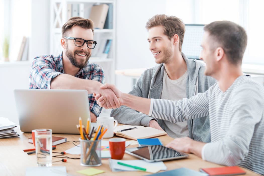 three men in an office