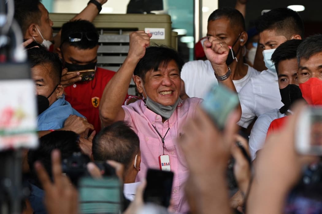 Ferdinand Marcos Jr celebrates with supporters.