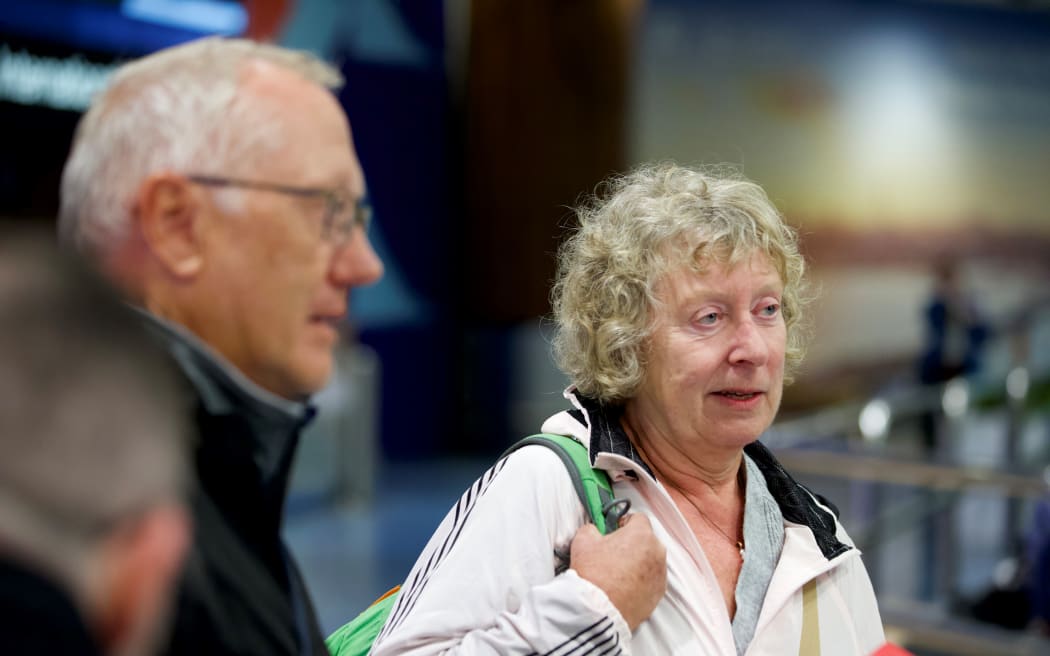 Some of the passengers on the special flight out of New Caledonia, after they had landed at Auckland Airport.