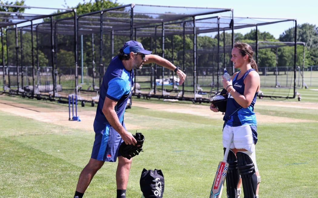 White Ferns assistant coach Dean Brownlie talks with Amelia Kerr in the nets.