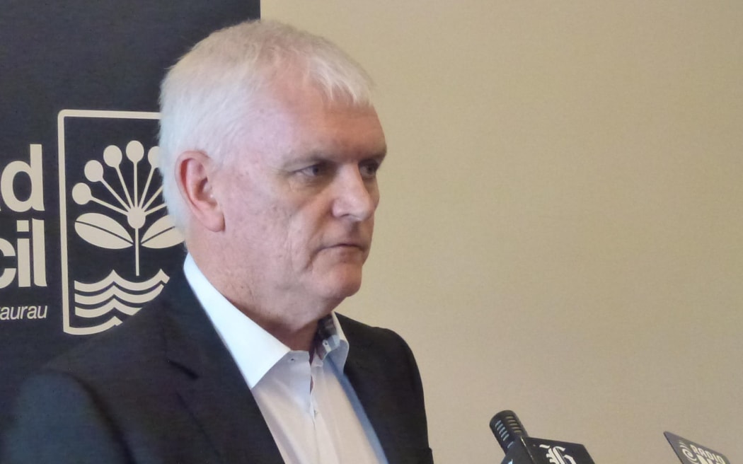 Doug McKay announcing the findings of the review in December 2013.