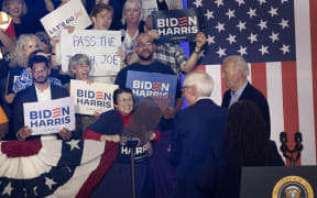 MADISON, WISCONSIN - JULY 05: An audience member holds a sign calling on President Joe Biden to "pass the torch" during a campaign rally at Sherman Middle School on July 05, 2024 in Madison, Wisconsin. Biden has been receiving criticism suggesting that he is too old and in too poor health to serve another term as president.   Scott Olson/Getty Images/AFP (Photo by SCOTT OLSON / GETTY IMAGES NORTH AMERICA / Getty Images via AFP)