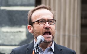 Green Party MP Adam Bandt addresses the crowd during a protest against US President Donald Trump and Australian Prime Minister Malcolm Turnbull and their Immigration and Refugee policies in Melbourne.