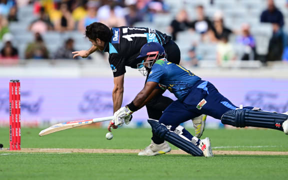 Ben Lister and Charith Asalanka.
New Zealand Black Caps v Sri Lanka, 1st Twenty20 International cricket match at Eden Park in Auckland, New Zealand. Sunday 2 April 2023. © Photo: Andrew Cornaga / www.photosport.nz