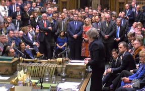A video grab from footage broadcast by the UK Parliament's Parliamentary Recording Unit (PRU) shows Britain's Prime Minister Theresa May (R) as she speaks in the House of Commons in London on January 15, 2019, after MPs voted to reject the government's Brexit deal.