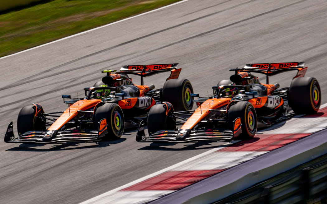 McLaren drivers Lando Norris (L) and Oscar Piastri