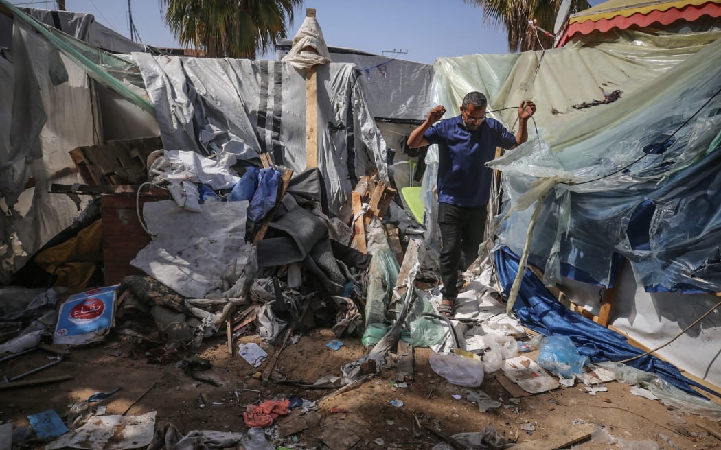 Palestinians are checking the damage at a makeshift camp for displaced people in front of the Al-Aqsa Martyrs Hospital in Deir al-Balah in the central Gaza Strip, after it was hit by an Israeli bombardment on March 31, 2024, amid the ongoing battles between Israel and the Hamas militant group. (Photo by Majdi Fathi/NurPhoto) (Photo by MAJDI FATHI / NurPhoto / NurPhoto via AFP)