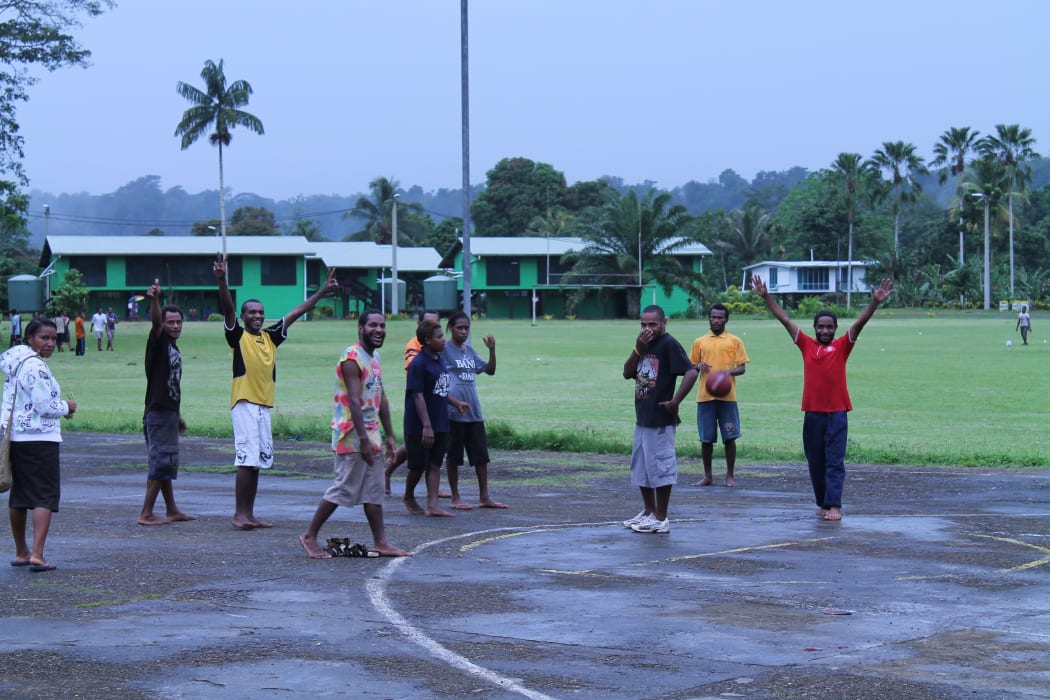 Students playing basketball at Kerevat National High School.