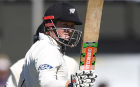 Henry Nicholls acknowledges the Basin Reserve crowd after bringing up his fourth test half century.