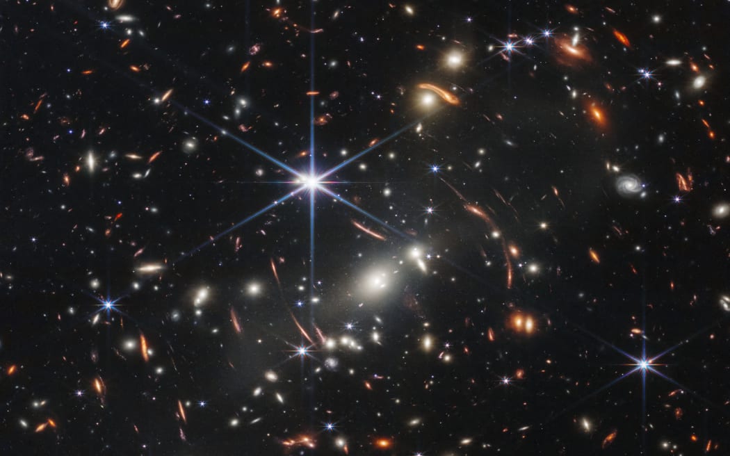 In this handout photo from NASA obtained on July 11, 2022, the first infrared image from the James Webb Space Telescope (JWST) is seen. - The JWST is the most powerful telescope launched into space and it reached its final orbit around the sun, approximately 930,000 miles from Earths orbit, in January, 2022. The technological improvements of the JWST and distance from the sun will allow scientists to see much deeper into our universe with greater detail. (Photo by Handout / NASA / AFP) / RESTRICTED TO EDITORIAL USE - MANDATORY CREDIT "AFP PHOTO / NASA" - NO MARKETING NO ADVERTISING CAMPAIGNS - DISTRIBUTED AS A SERVICE TO CLIENTS