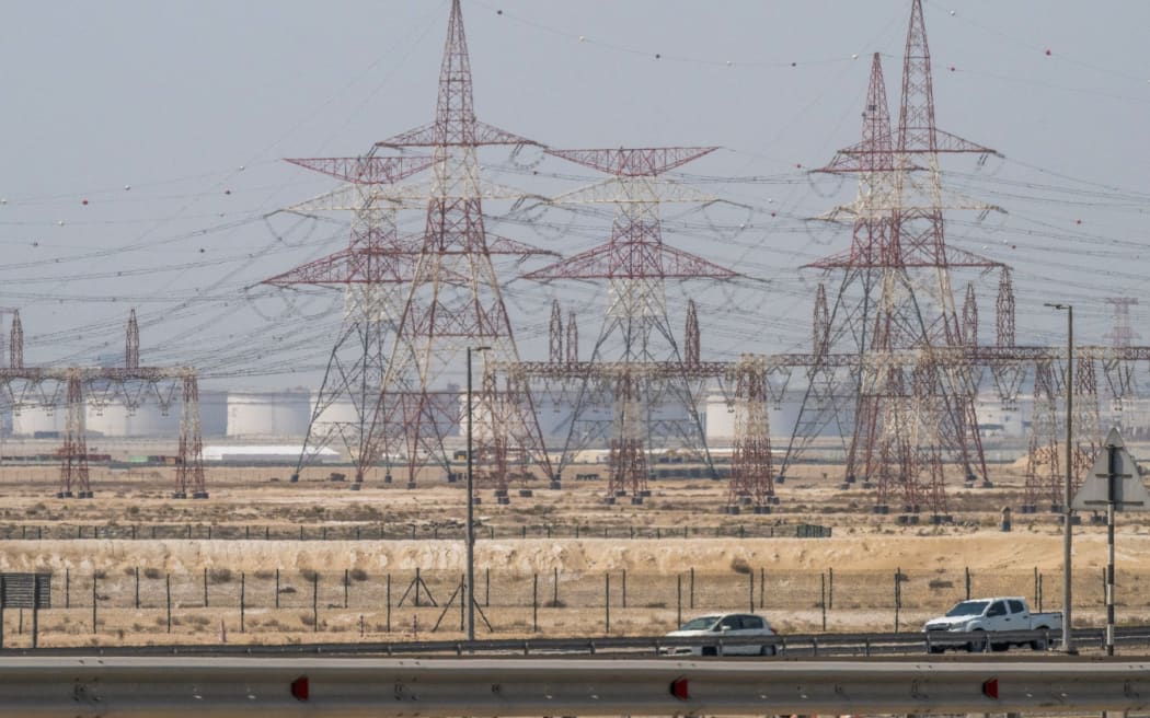 Motorists drive past an ADNOC Gas, a subsidiary of the Abu Dhabi National Oil Company, facility in Abu Dhabi on 3 March, 2026.