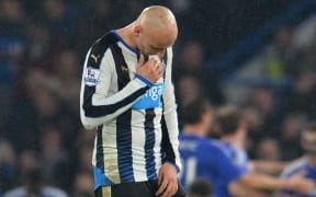 Newcastle United's English midfielder Jonjo Shelvey reacts after Chelsea scored their fifth goal during the English Premier League football match between Chelsea and Newcastle United at Stamford Bridge in London on February 13, 2016