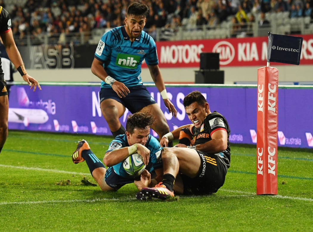 Harry Plummer scores a try for the Blues.
in a Super Rugby game at Eden Park.