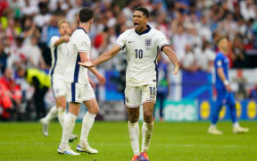 Jude Bellingham celebrates as he scores for England against Slovakia at Euro 2024