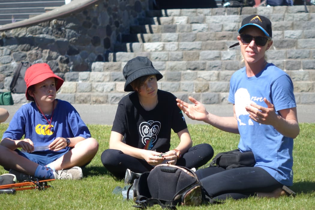 Taranaki Kiwi Trust's Sian Portier briefs students from Oakura School