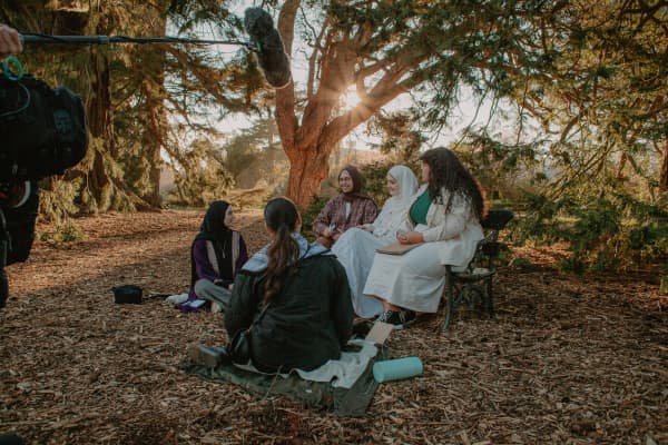 Behind the scenes shots of interviewees Shifa Ahmed and Te Aorangi-Kowhai Penetito Morini from the second episode of the Ahi Wānanga series.