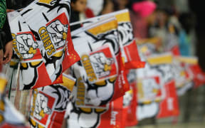 Flags are waved during a Chiefs vs Hurricanes game in 2013