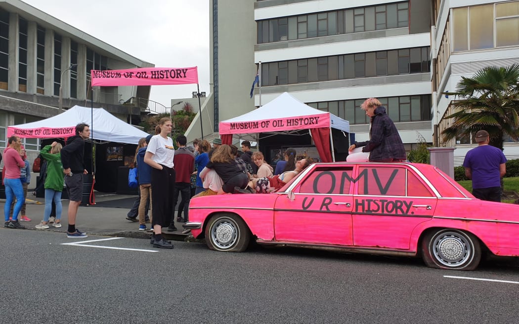 Protesters set up the 'History of oil museum' at the entrance to OMV's offices this morning.
