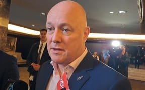 National Party leader Christopher Luxon arrives at an Auckland hotel to continue discussions on forming the next government.